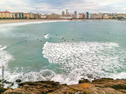 Surf school students practicing from Orzán Beach in La Coruña photo