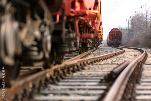 Train wagons carrying freight containers for shipping companies. distribution and freight transport by a railway, transport concept