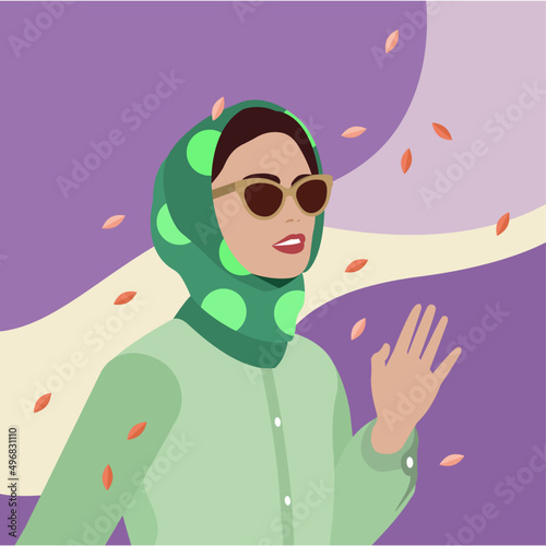 Mujer con pañuelo y gafas saludando