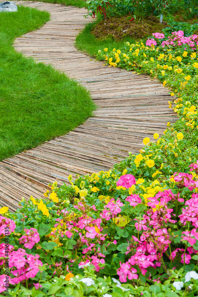 Green Path in ornate backyard flower Garden Green Path in ornate backyard flower Garden