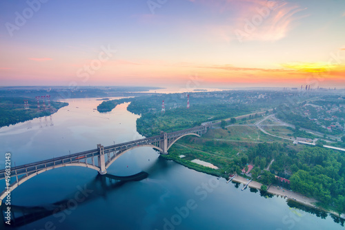 Dawn over the Dnieper river and Preobrazhensky bridge in Zaporozhye, view from the highest crane in Ukraine (200 m)