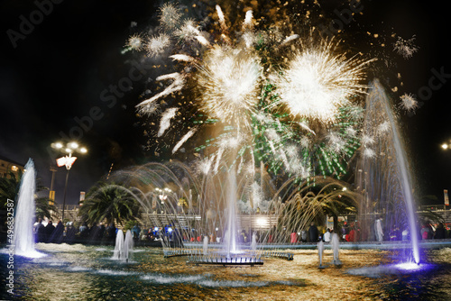 Beautiful shot of fireworks glowing in the night sky during the Carnival of Viareggio