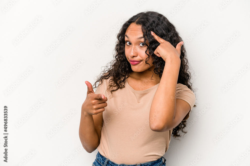 Young hispanic woman isolated on white background pointing temple with finger, thinking, focused on a task. Young hispanic woman isolated on white background pointing temple with finger, thinking, focused on a task.