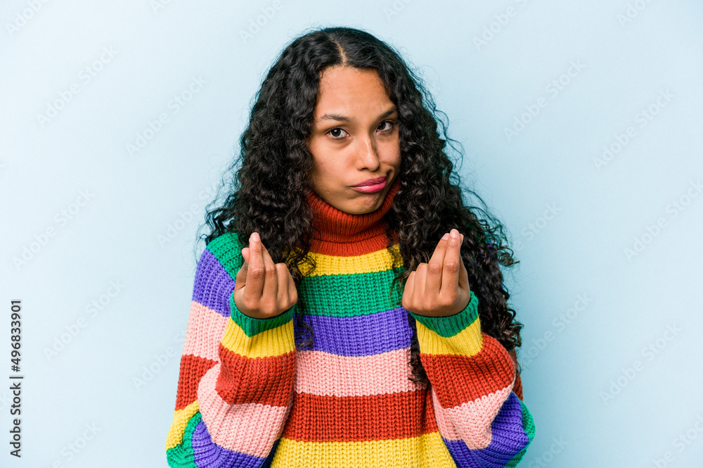 Young hispanic woman isolated on blue background showing that she has no money. Young hispanic woman isolated on blue background showing that she has no money.