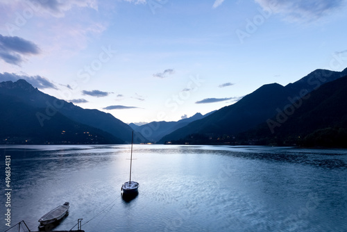 Boat moored on Lake Ledro. Ledro valley, Trento province, Trentino Alto-Adige, Italy, Europe.  photo