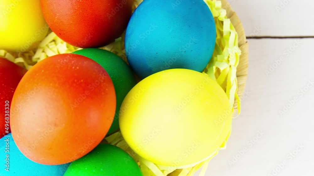 Easter eggs in brown bowl. Happy Easter holiday. Colorful painted eggs. Bright boiled eggs. Easter traditional decoration. Christian holiday. Easter celebration. Spring holidays concept. Easter eggs in brown bowl. Happy Easter holiday. Colorful painted eggs. Bright boiled eggs. Easter traditional decoration. Christian holiday. Easter celebration. Spring holidays concept.