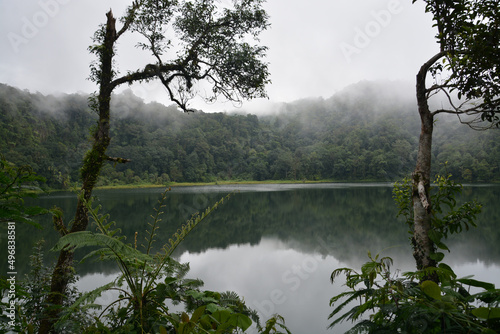 View of Ranamese Lake near trees in East Manggarai, Flores, Indonesia photo