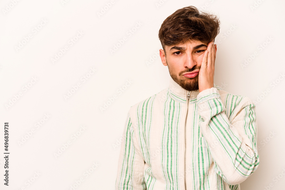 Young hispanic man isolated on white background who feels sad and pensive, looking at copy space. Young hispanic man isolated on white background who feels sad and pensive, looking at copy space.