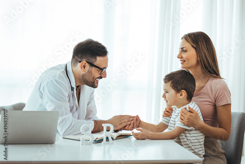 Male pediatrician hold stethoscope exam child boy patient visit doctor with mother, paediatrician check heart lungs of kid do pediatric checkup in hospital children medical care concept