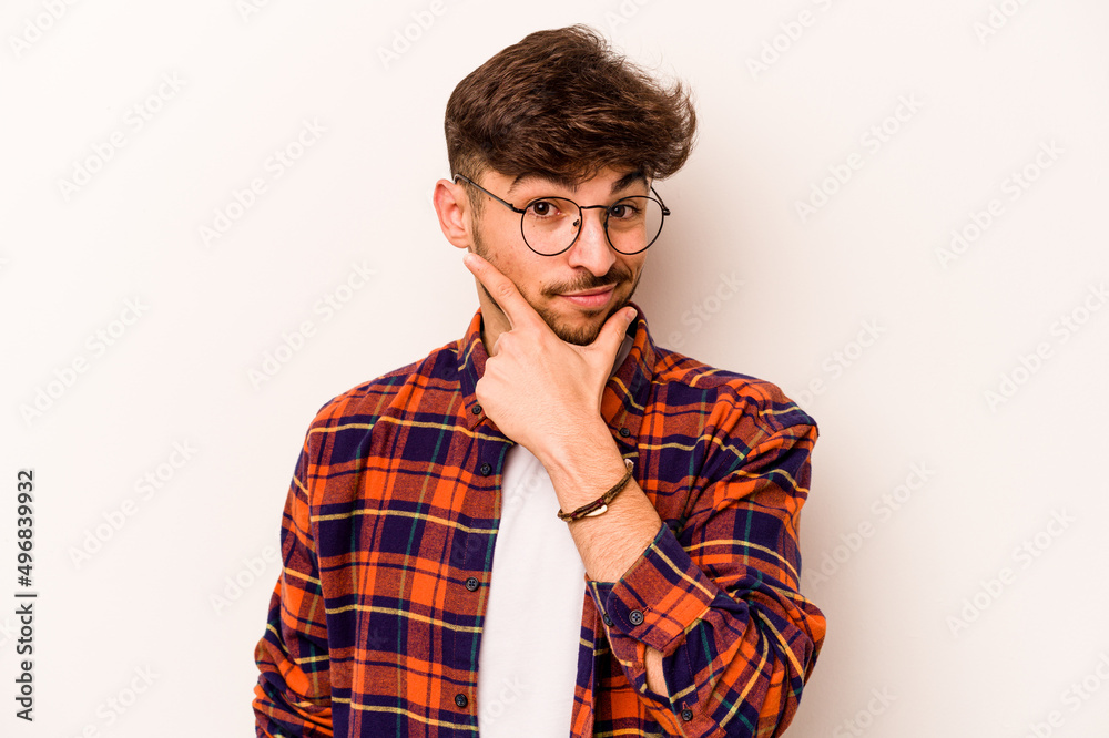 Young hispanic man isolated on white background contemplating, planning a strategy, thinking about the way of a business. Young hispanic man isolated on white background contemplating, planning a strategy, thinking about the way of a business.