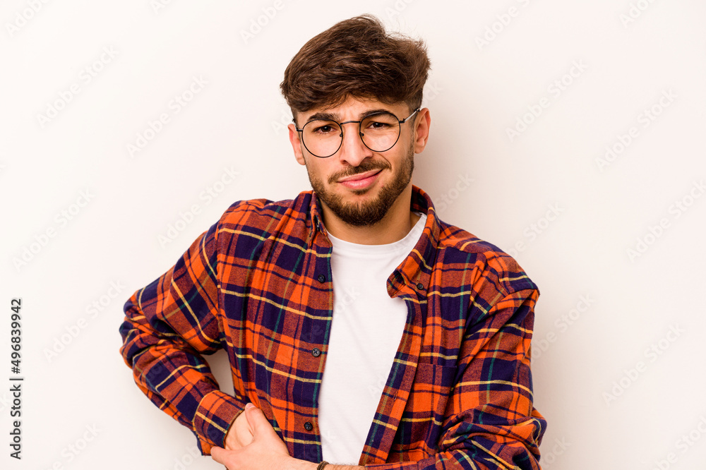 Young hispanic man isolated on white background having a liver pain, stomach ache. Young hispanic man isolated on white background having a liver pain, stomach ache.