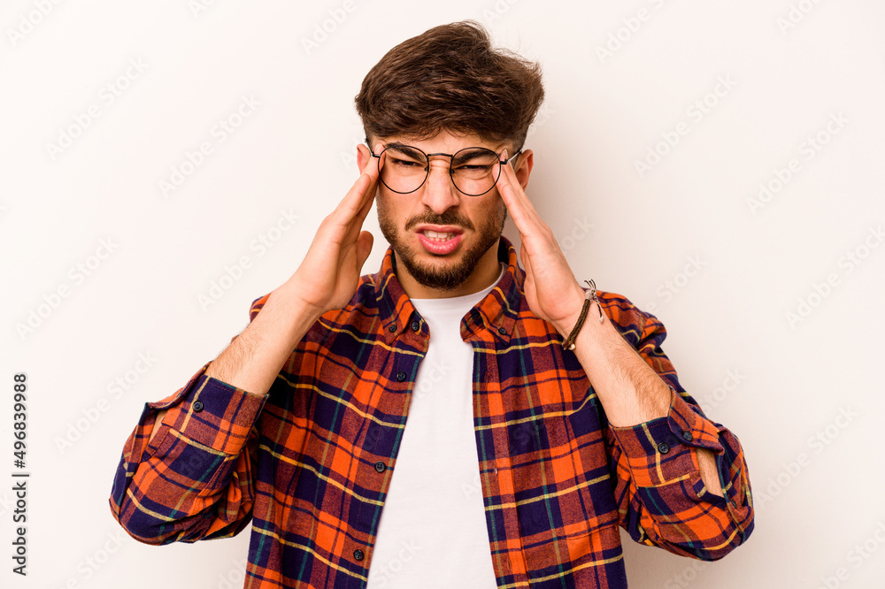 Young hispanic man isolated on white background touching temples and having headache. Young hispanic man isolated on white background touching temples and having headache.