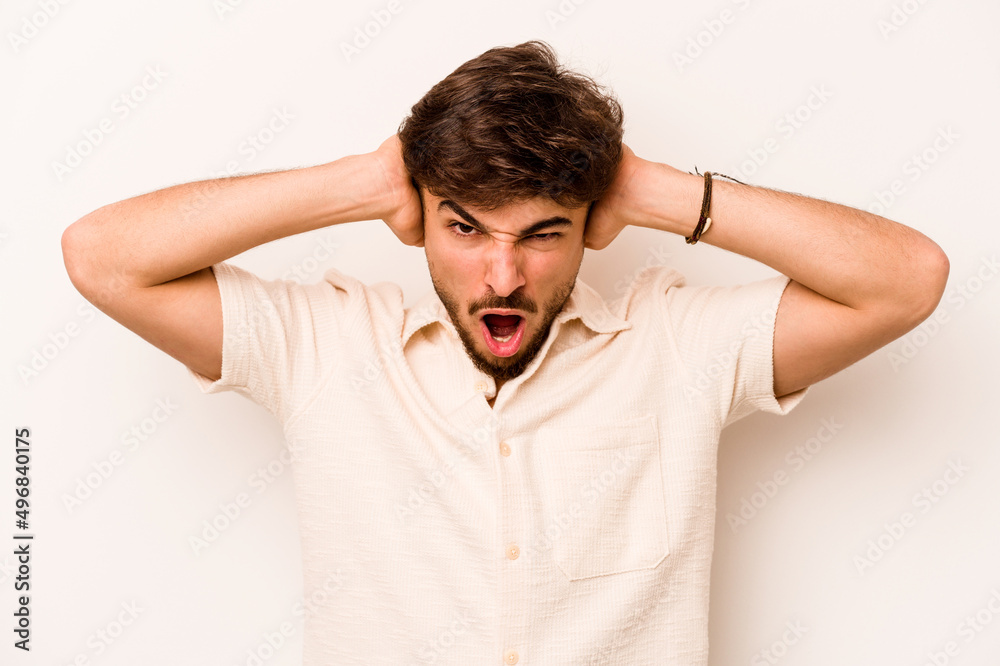 Young hispanic man isolated on white background screaming, very excited, passionate, satisfied with something. Young hispanic man isolated on white background screaming, very excited, passionate, satisfied with something.