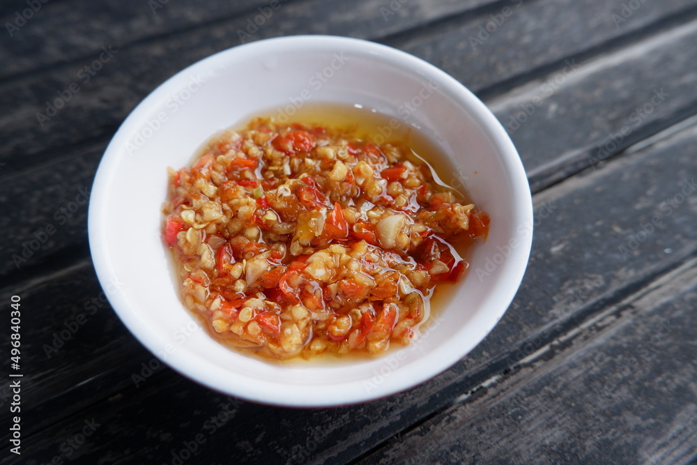 Sambal korek or Indonesian chili sauce or paste is usually made from a mixture of various chilies with additional ingredients such as shrimp paste, garlic, ginger, shallots and stir-fry Sambal korek or Indonesian chili sauce or paste is usually made from a mixture of various chilies with additional ingredients such as shrimp paste, garlic, ginger, shallots and stir-fry