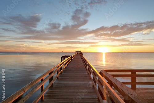 Scenic view of a wooden pier over the body of water in  Rotary Riverfront Park in Titusville photo