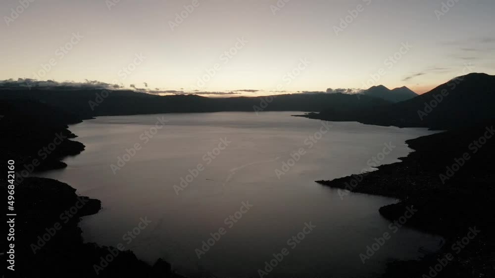Drone shot of Calm Lake Atitlan in Guatemala during sunset Drone shot of Calm Lake Atitlan in Guatemala during sunset