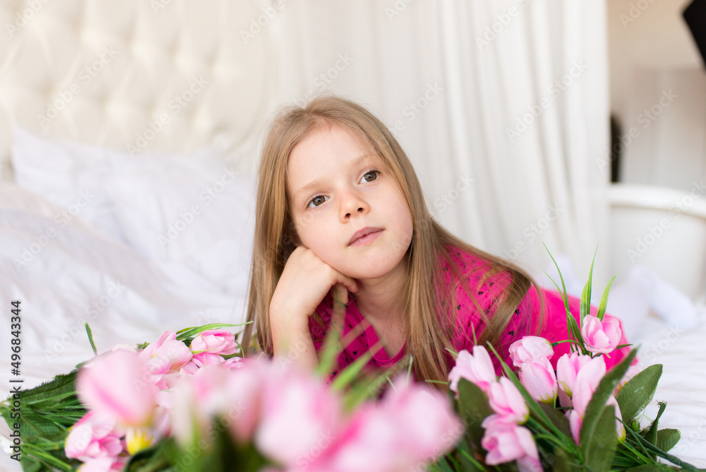 Portrait of a cute little girl with flowers. Spring portrait. Mothers Day.
Portrait of a cute little girl with flowers. Spring portrait. Mothers Day.