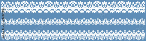Set of wide lace ribbons with print. White design elements isolated on blue background. Seamless pattern for creating style of card with ornaments. Lace decoration template, ribbons for design