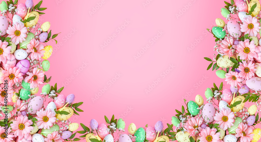 Easter pink background with eggs and flowers . Top view flat lay background . Greeting card pattern with copy space.