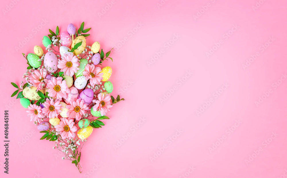 Bouquet of flowers and Easter colored eggs on a pink background. Easter card with space for text. Bouquet of flowers and Easter colored eggs on a pink background. Easter card with space for text.