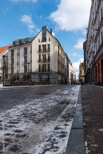 Cobblestone street with a little bit of snow in the Old Town Riga, Latvia