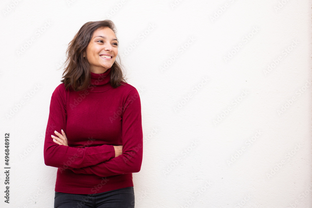 attractive young woman smiling with arms crossed by white isolated background attractive young woman smiling with arms crossed by white isolated background