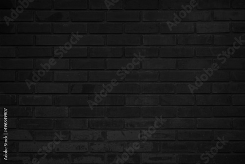 Black brick wall abstract background. Design geometric dark texture room decoration. 