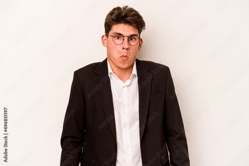 Young caucasian business man isolated on white background shrugs shoulders and open eyes confused. Young caucasian business man isolated on white background shrugs shoulders and open eyes confused.