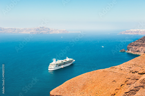 Cruise ship near the sea coast of Santorini island, Greece. Summer landscape