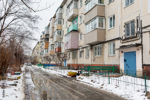 View of Khrushchyovka, common type of old low-cost apartment building in Russia and post-Soviet space. Kind of prefabricated buildings. Built in 1960s. Winter shot. Russia, Vladivostok.