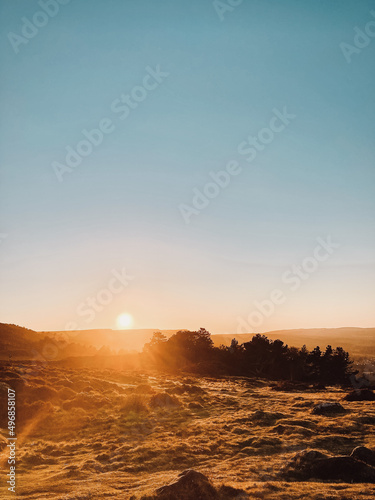 Vertical shot of the Ilkley Moor in West Yorkshire, England during a bright sunset photo