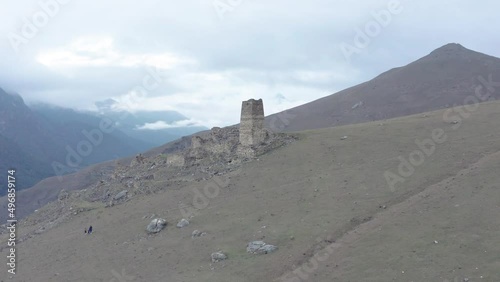 Drone flying clockwise around old ruins  on top of mountain, Galiat village, Digoriya gorge, Northern Ossetia, Caucasus, Russia photo