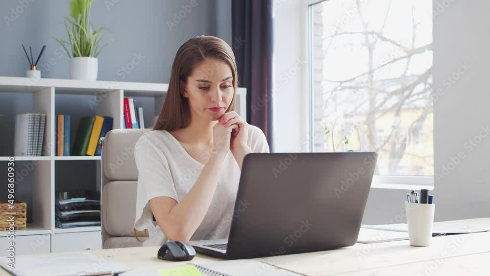 Young Woman Works at Home Office Using Computer. Workplace of Female Entrepreneur, Freelancer or Student. Remote Work and Education Concept. Young Woman Works at Home Office Using Computer. Workplace of Female Entrepreneur, Freelancer or Student. Remote Work and Education Concept.