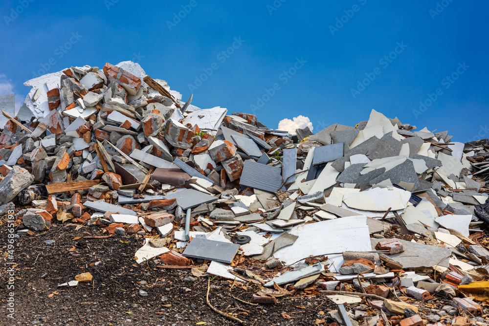 A view of the rubble, fragments of concrete, bricks and tiles piled up like hills.