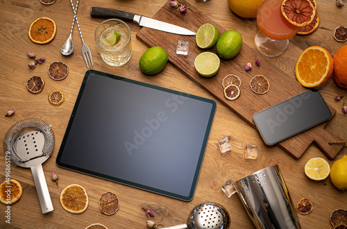 Obraz na płótnie Online cocktail course with blank tablet, smartphone and bartender tools on wood kitchen table w salonie