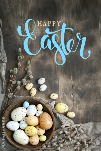 Congratulatory easter background. Easter eggs and flowers. Selective focus. Top view.