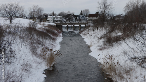 Принти на полотні Frozen river with sluice gate in Cornwall, Ontario, Canada