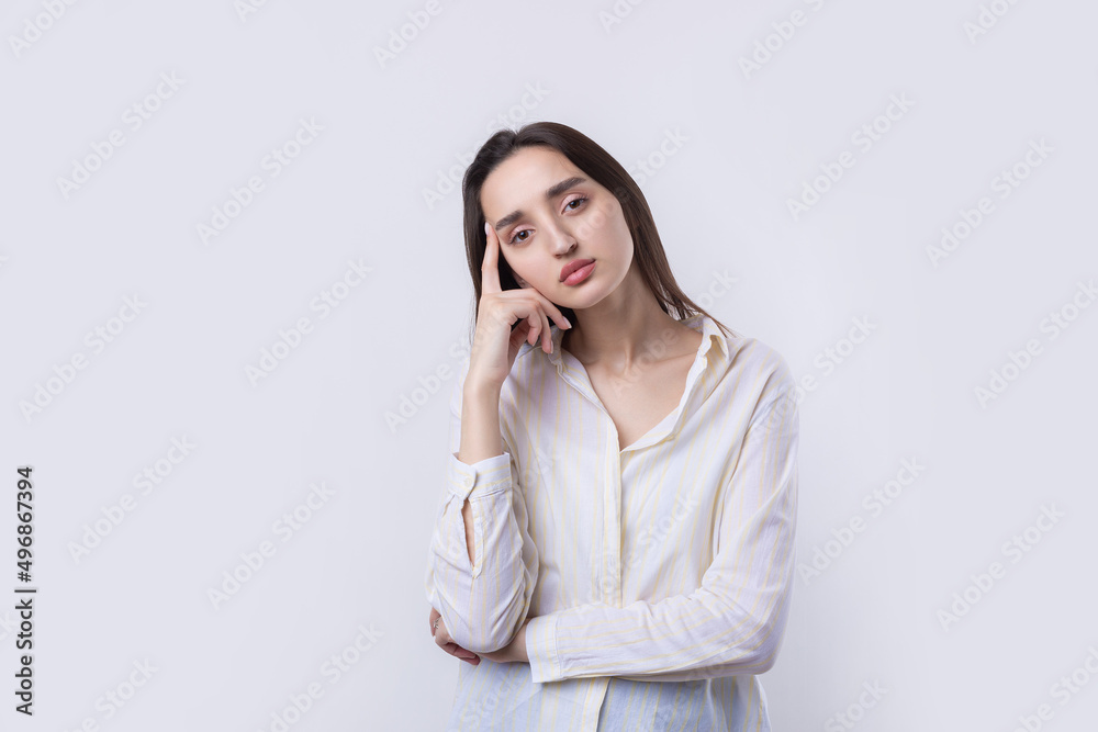 Portrait of a beautiful young woman thinking, isolated on white background Portrait of a beautiful young woman thinking, isolated on white background