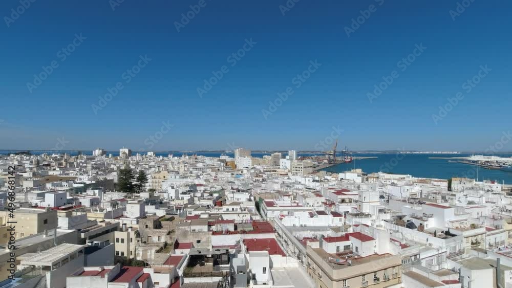 Pan over whitewashed houses of Cadiz city from high above viewpoint Pan over whitewashed houses of Cadiz city from high above viewpoint