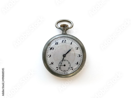 Isolated old pocket watch. Close up of wind-up vintage clock. Fashion accessory. Time concept. Mechanical stopwatch in a metal case on a white background.