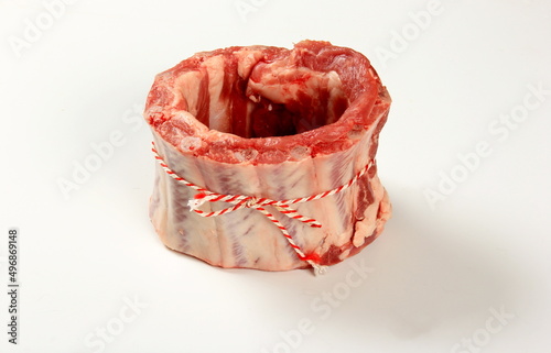 Raw fresh meat crown. Pork rib crown tied with decorative thread on a white background  photo