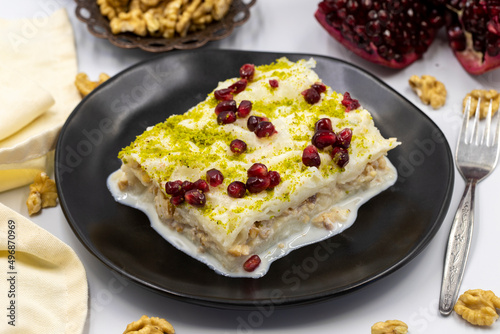 Gullac dessert ( milk dessert ) on a white background. Traditional Turkish dessert. close up