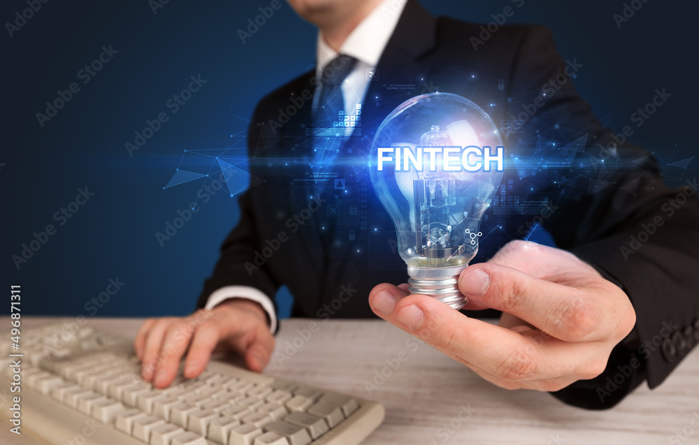 Businessman holding a light bulb Businessman holding a light bulb