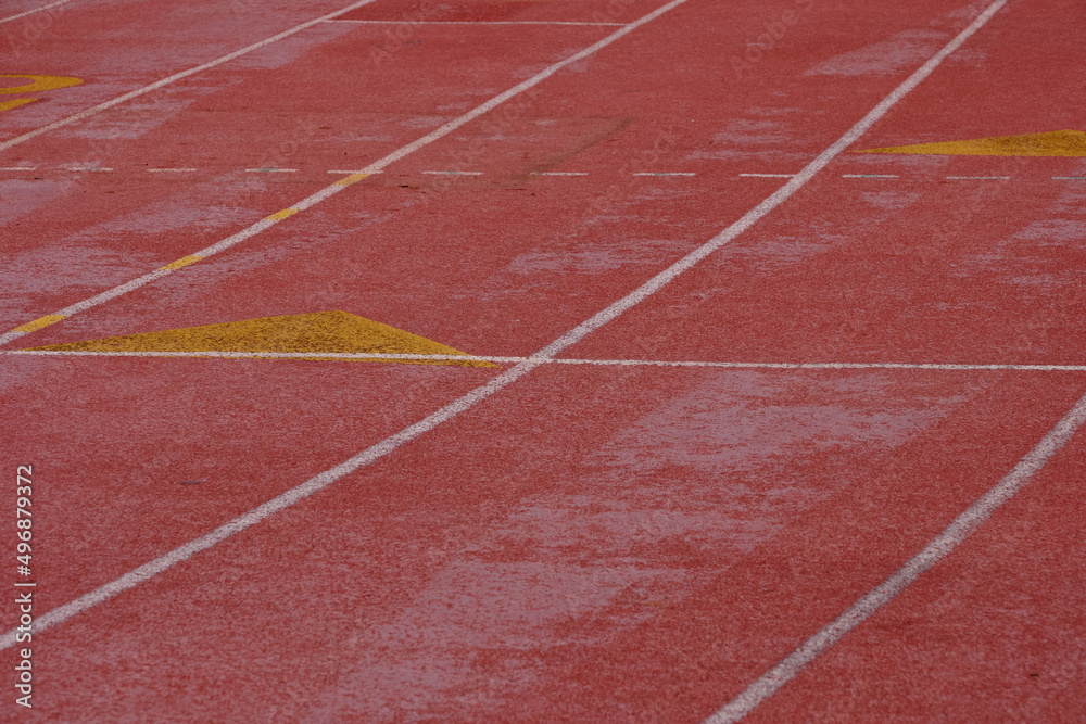 The red pavement and the starting grid for runners on a High School track