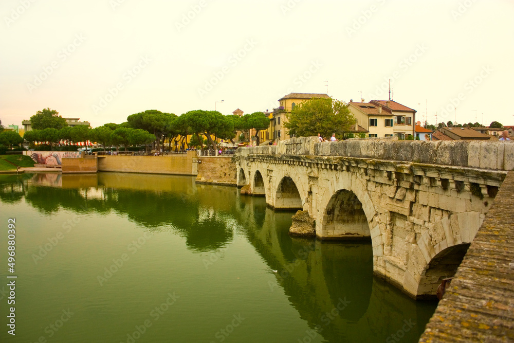 Historical roman Tiberius Bridge over Marecchia river in Rimini, Italy