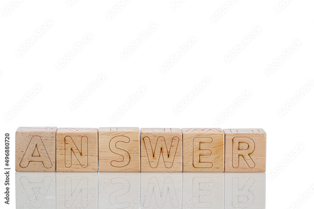 Wooden cubes with letters answer on a white background