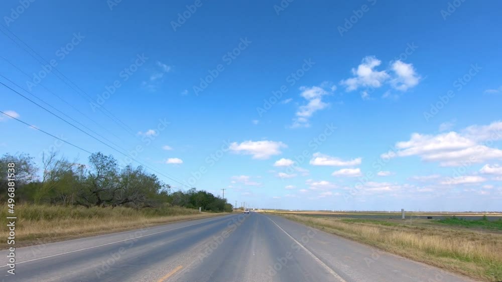POV driving through rural Rio Grande Valley in southern Texas past vegetable fields ; concepts of agriculture, food and open road POV driving through rural Rio Grande Valley in southern Texas past vegetable fields ; concepts of agriculture, food and open road