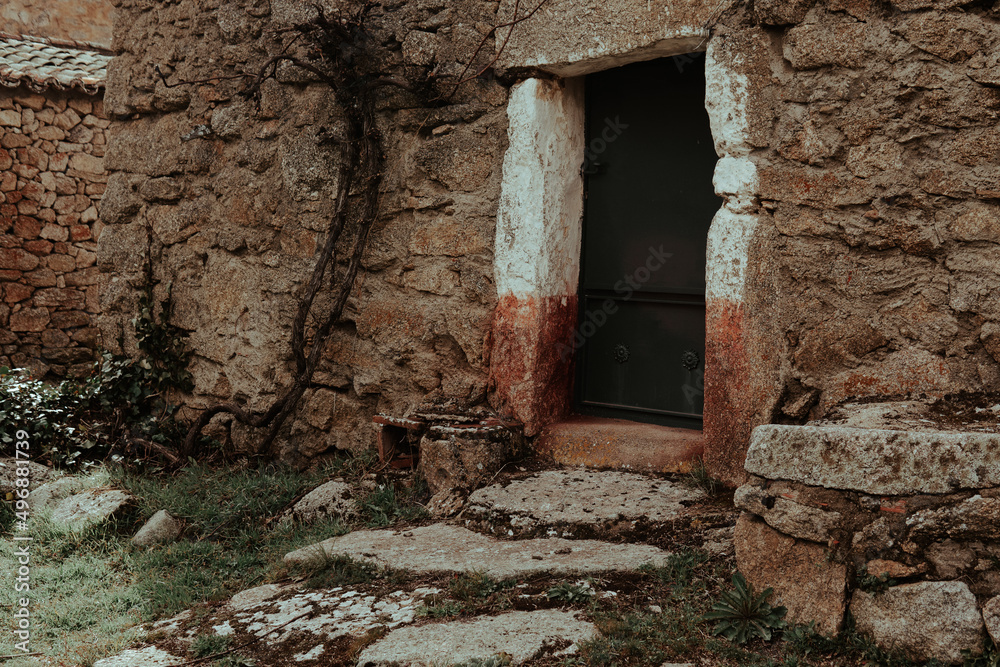 Entrance of an old house with a stone floor