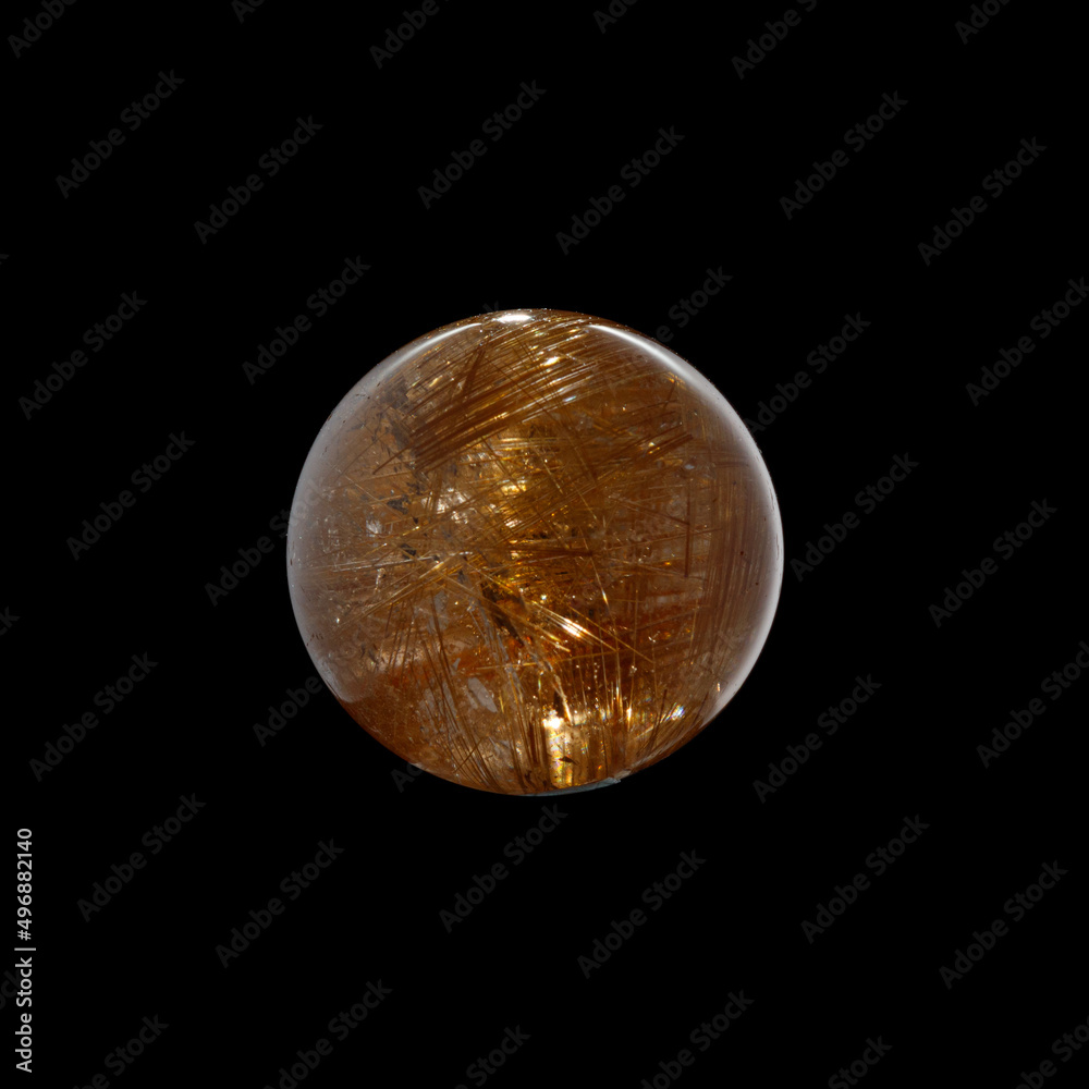 Ball of quartz with rutile on a black background Ball of quartz with rutile on a black background