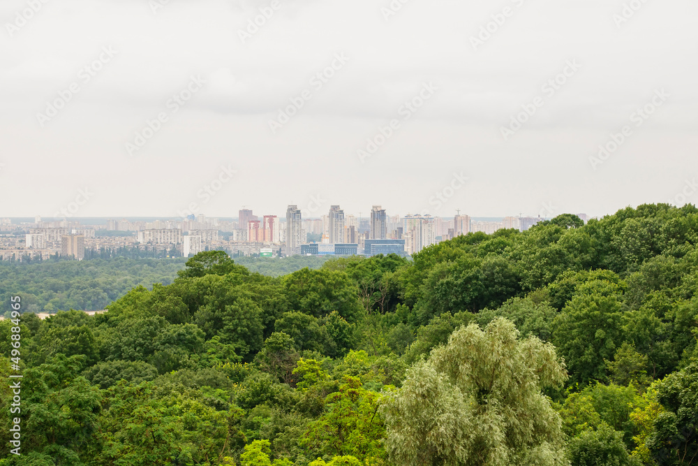 Kyiv, Ukraine. July 19. 2014. Cityscape of Kyiv, view of the left bank and the Dnieper River. Modern city in the distance, evening time